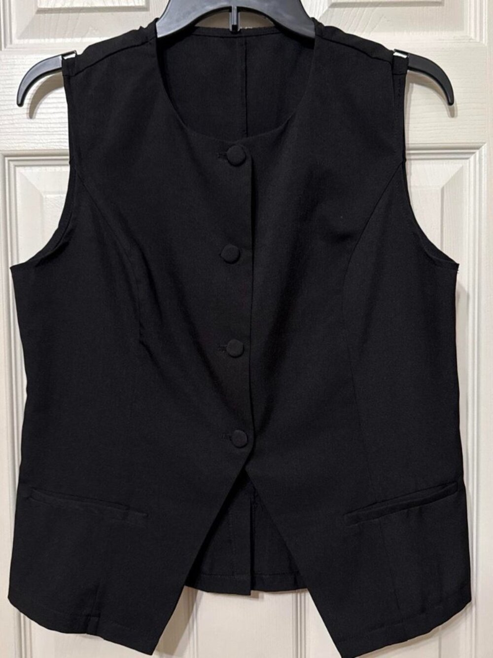 Black sleeveless vest with button front and faux pockets #formal #gilet